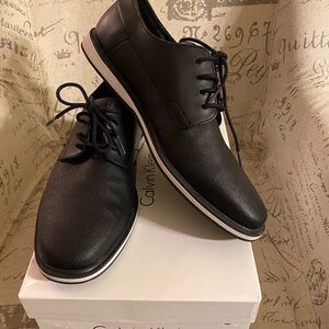 Calvin Klein men’s dress shoes. Black in size 8 in original box.